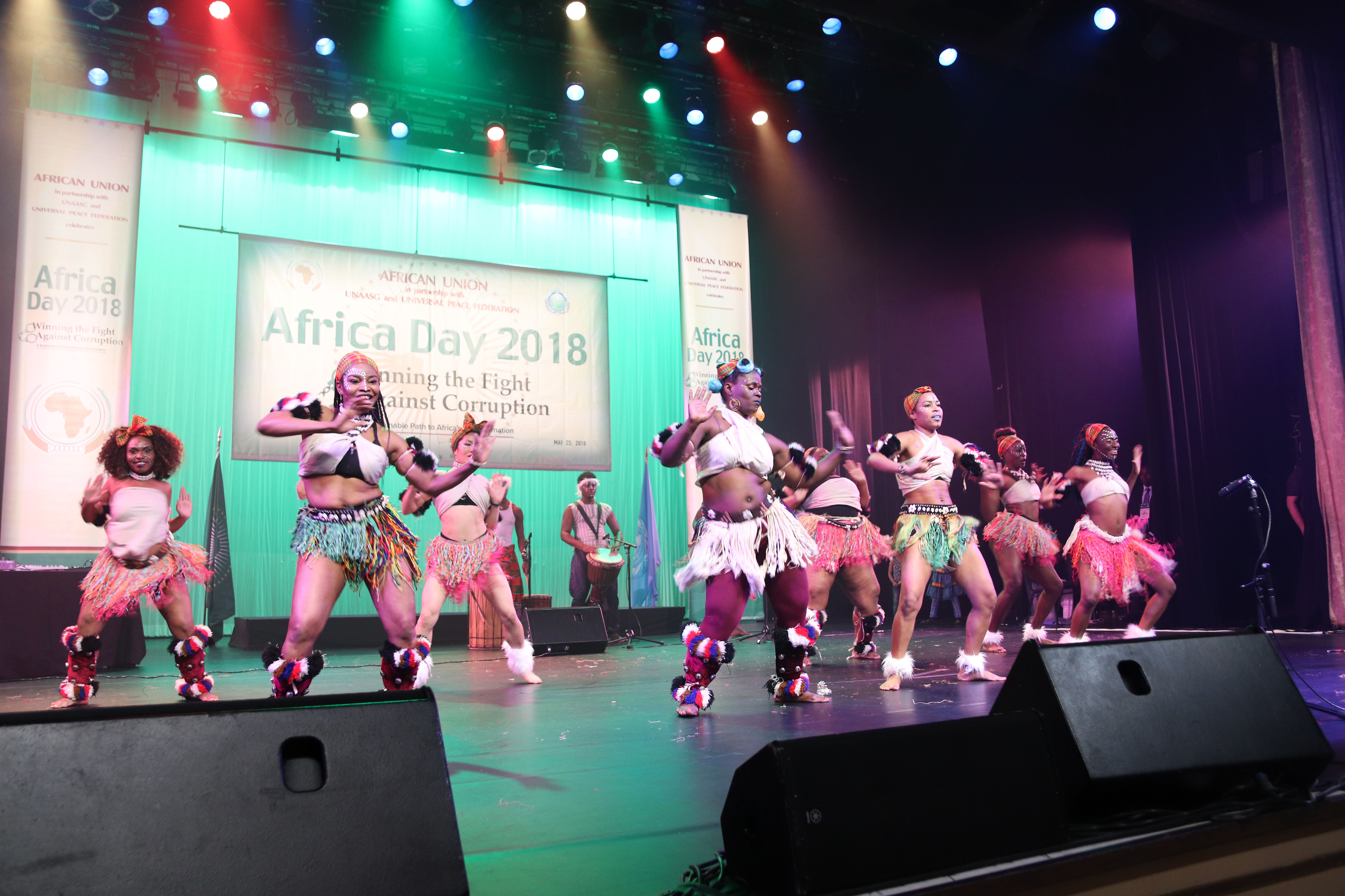 Siren performers at a large group dance performance celebrating African culture